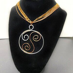Hammered stainless steel and copper wire swirl pendant with gold ribbon necklace